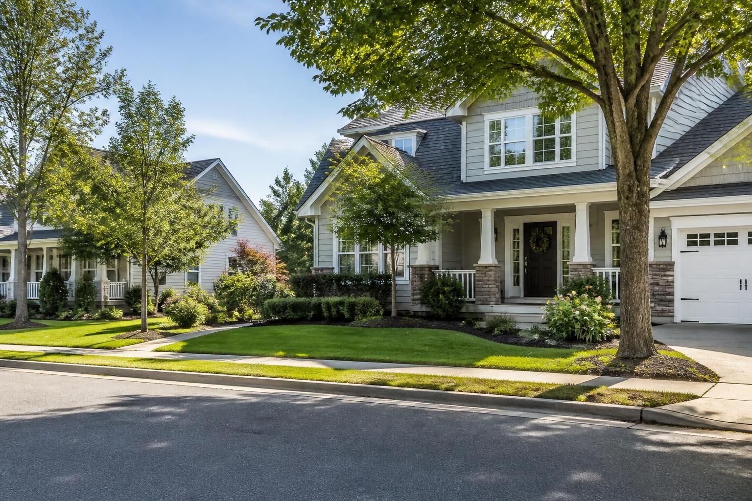 Peaceful suburban neighborhood with neat homes and mature trees.